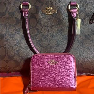 Metallic berry coach wallet.